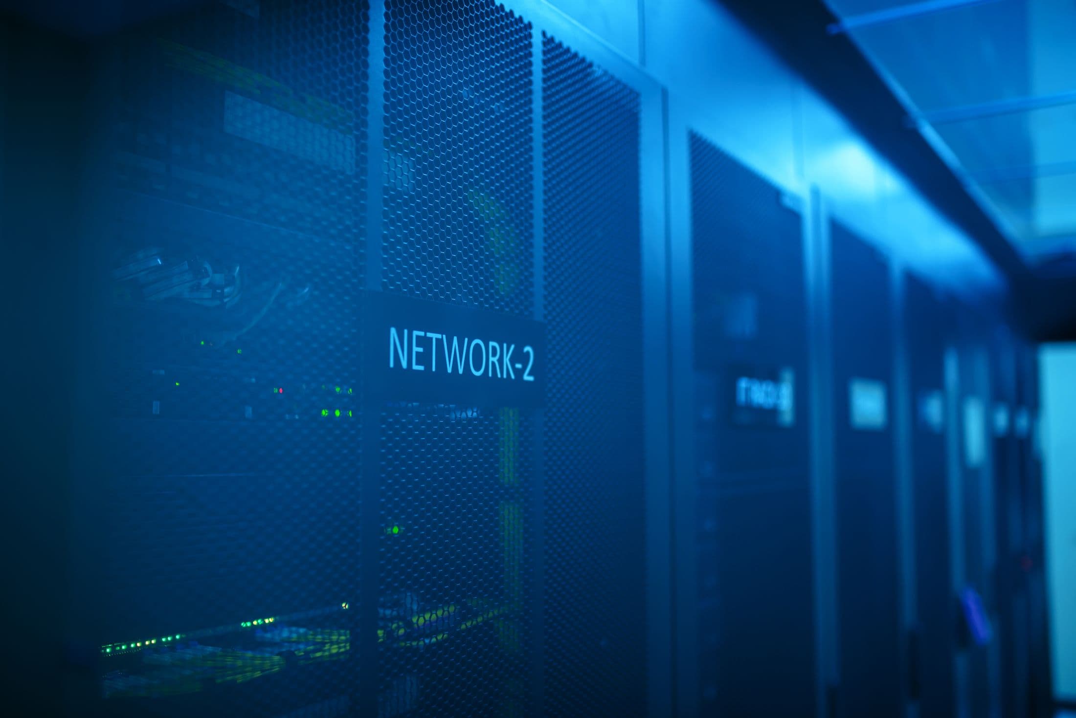 A data center aisle, the kind of secure infrastructure Atlas runs on