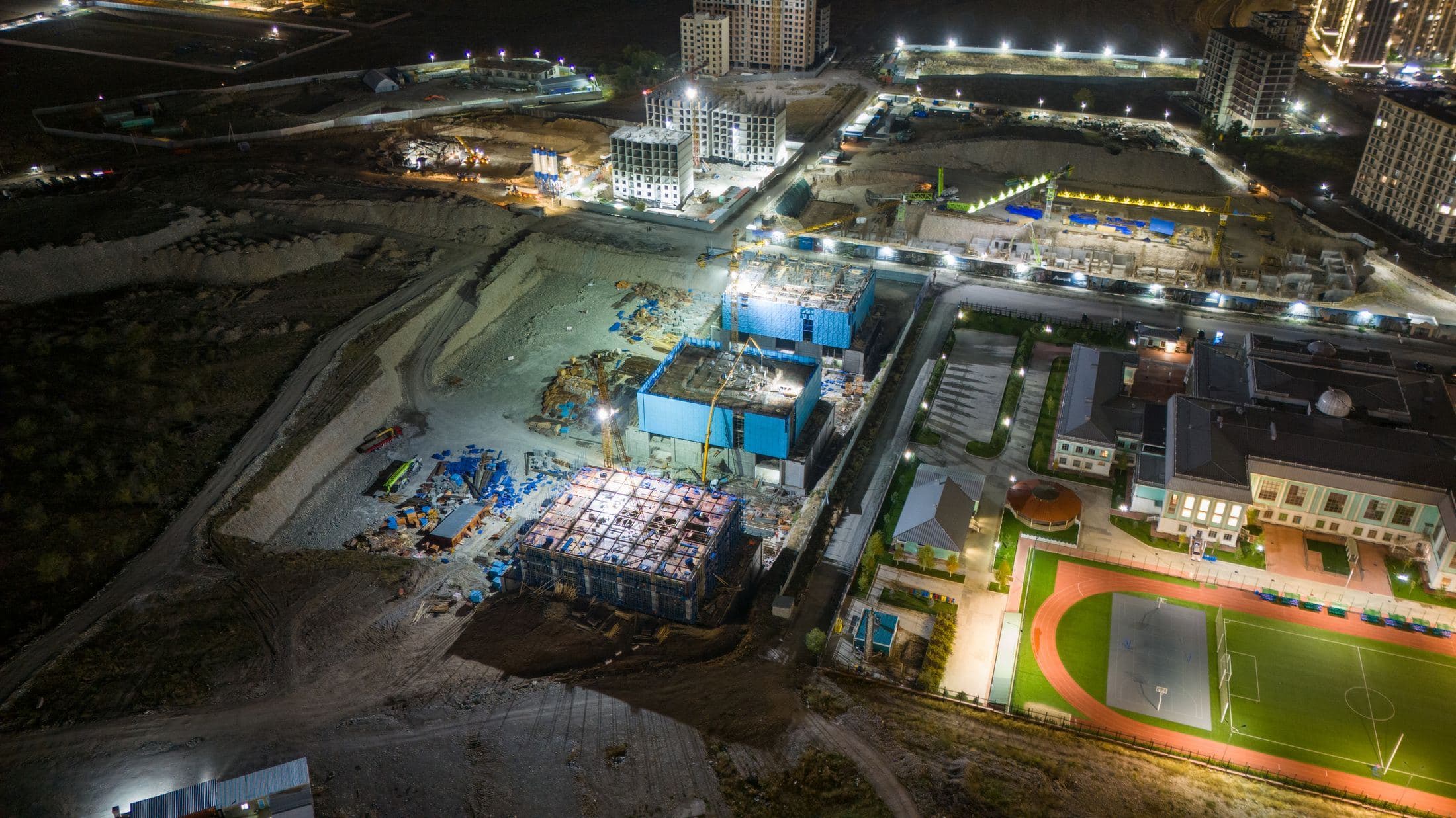 Construction crew working on an active jobsite at golden hour